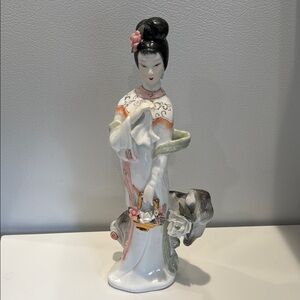 Elegant Porcelain Figurine with Floral Accents